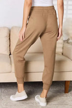 RISEN High Rise Relaxed Joggers in light brown with drawstring waist and cuffed ankles
