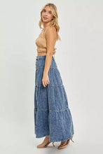 Blue denim risen high rise ruffle long skirt with a tiered design and relaxed flowing silhouette