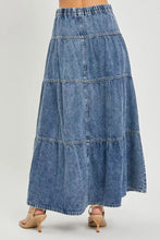 A tiered denim ruffle maxi skirt with elastic waistband and relaxed fit from the risen high rise collection