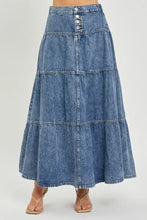 Blue denim risen high rise ruffle tiered maxi skirt with button closure in a high rise silhouette