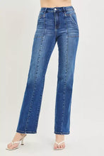 High-waisted blue denim risen high rise straight jeans with patch pockets and visible seamed stitching details