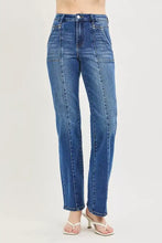 Risen high rise straight patch pocket seamed jeans in medium blue denim with visible stitching and high waist design
