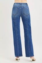 Blue denim risen high rise straight jeans with a straight-leg cut and classic back pockets shown from the back side