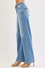 Risen light-wash denim high rise wide baggy jeans with classic five-pocket design and wide baggy fit