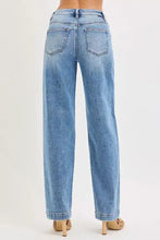 Back side of risen high rise wide baggy jeans in light-wash denim with straight-leg cut and classic back pockets