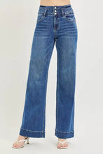 Risen high rise wide leg blue denim jeans with button closure and wide band detail for a stylish fit