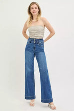 High-waisted blue denim risen high rise wide leg jeans with button-front closure and classic stitching details