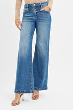 Blue denim risen high rise wide leg jeans with classic five-pocket design and subtle fading for a worn-in look