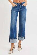 Blue denim risen mid rise ankle straight jeans with rolled cuffs and a slightly faded wash