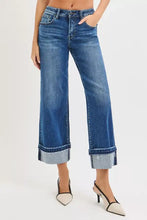 Blue denim risen mid rise ankle straight jeans with rolled cuffs and a slightly faded wash