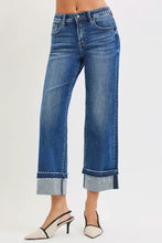 Blue denim risen mid rise ankle straight jeans with wide-leg cut and rolled cuffs featuring frayed edges