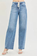 Light-wash denim jeans with a wide-leg cut and white drawstring waist from risen relaxed fit collection