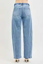 Light-wash denim RISEN relaxed fit jeans with a drawstring waist and wide-leg cut for comfortable casual wear
