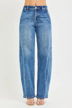 High-waisted blue denim risen slouchy baggy jeans with straight-leg cut and subtle fading