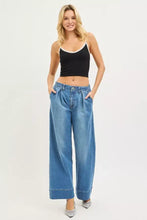 Blue wide leg denim jeans with a relaxed high waisted fit and rolled cuffs from risen slouchy wide leg collection