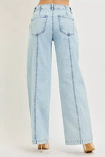 Light-wash denim risen slouchy wide leg jeans with high-rise waist and prominent front pockets