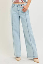 Light-wash denim risen slouchy wide leg jeans with prominent vertical seam detailing for a relaxed fit