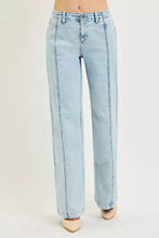 Risen slouchy wide leg light-wash denim jeans with straight-leg cut and visible side stitching