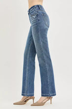 Back side of medium-wash blue denim risin tummy control jeans with crease line and subtle distressing on natural waistline