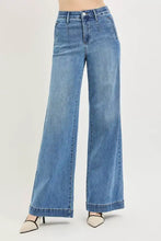 Risen tummy control elastic band high rise wide jeans in light-wash blue denim with frayed hems and classic five-pocket design