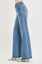Light-wash blue denim wide jeans with high rise tummy control elastic band and rolled cuffs in classic five-pocket design