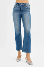 Risen tummy control high rise crop straight jeans in medium-wash denim with subtle fading and whiskering details