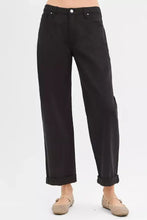 Black high-waisted risen tummy control trousers with ankle barrel cut and rolled cuffs for relaxed fit