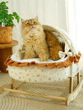 Fluffy golden cat in Rocking Pet Bed with Canopy, wooden frame, rocking motion