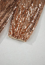 Rose gold sequin clutch bag with backless sequin mock neck design