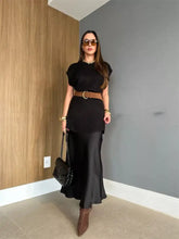 Black quilted chain strap handbag with round neck cap sleeve sweater dress