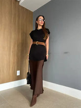 Black ribbed round neck cap sleeve sweater dress with cinched waist