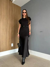 Black satin midi skirt with sleek flowing silhouette in Round Neck Cap Sleeve Sweater Dress