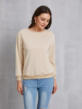 Beige round neck dropped shoulder sweatshirt with ribbed cuffs