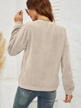 Beige long-sleeve round neck dropped shoulder sweatshirt with THE HELL I WON’T graphic and textured pattern