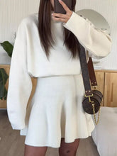 Brown Louis Vuitton circular handbag with monogram canvas on mini sweater dress