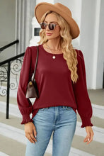 Women’s maroon round neck long sleeve blouse with puff shoulders