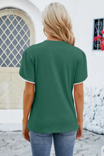 Round neck petal sleeve T-shirt in dark green with white pom-pom trim