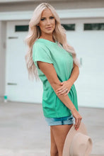 Light green round neck pocket tee shirt with short sleeves