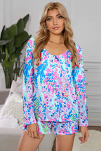 Vibrant round neck printed top and shorts lounge set featuring long sleeve length and bold abstract floral pattern