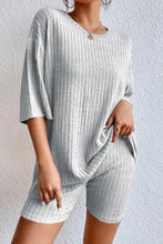 Light gray round neck ribbed knit lounge set with relaxed fit top and matching shorts in two-piece design