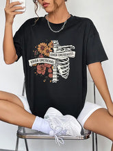 Black round neck short sleeve graphic t-shirt with skeleton floral print
