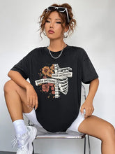 Black floral skeleton graphic on oversized round neck short sleeve t-shirt