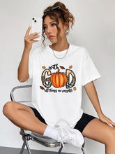 White round neck short sleeve graphic t-shirt with God pumpkin design