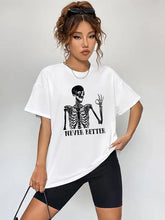 Woman in round neck short sleeve graphic t-shirt with skeleton and black cycling shorts