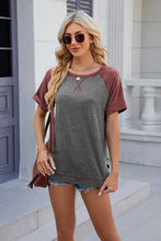 Women’s round neck short sleeve raglan t-shirt with gray body and burgundy sleeves