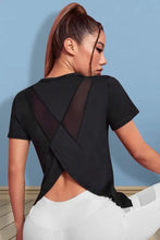 Women’s round neck short sleeve black athletic top with crisscross back