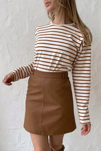 Women’s round neck striped dropped shoulder long-sleeve top with brown mini skirt