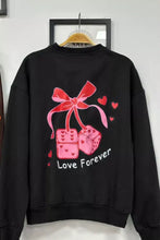 Black sweatshirt with pink bow dice graphic and love forever text