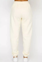 Cream-colored cotton joggers with elastic cuffs in Round Neck Sweatshirt and Joggers Set