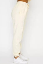 Cream-colored soft cotton joggers with drawstring waist in Round Neck Sweatshirt and Joggers Set